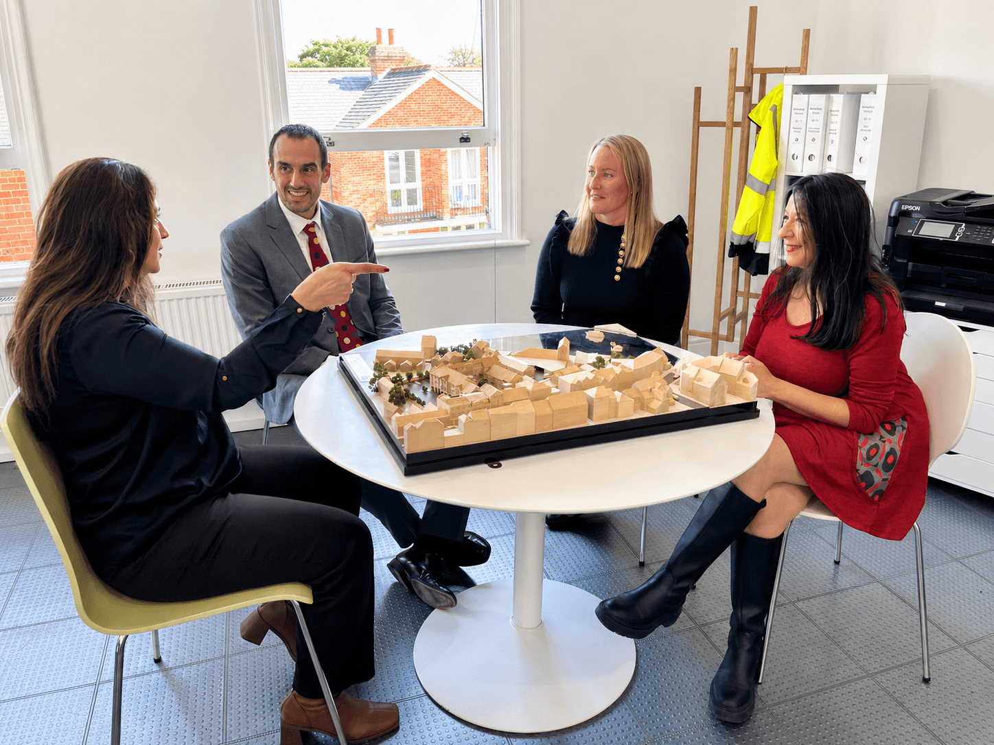 Sempre Property team around an architectural model